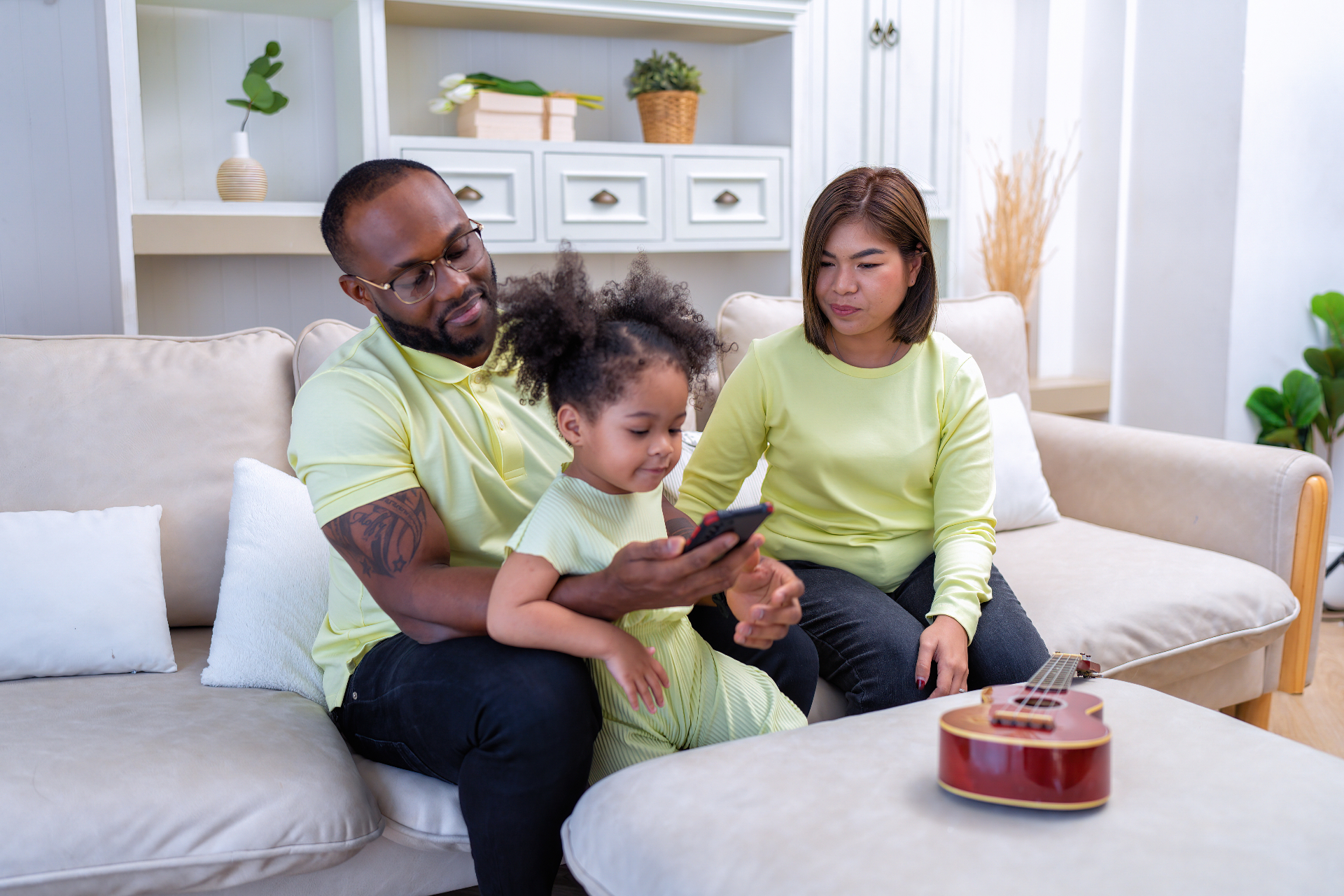 Family relaxing together on a sofa at home